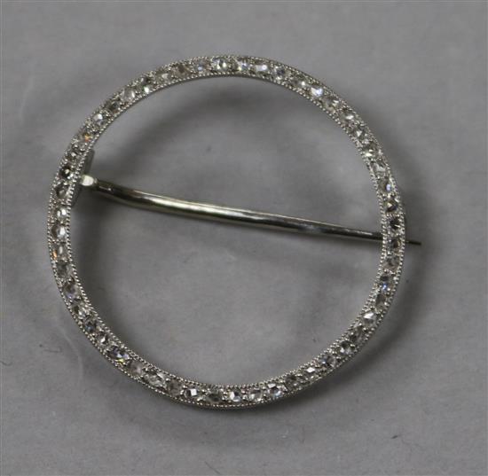 An early to mid 20th century white metal and diamond set circular open brooch, bearing the inscription Lacloche Freres Paris,